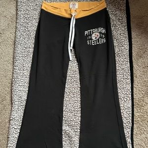 Ladies Pittsburgh Steelers flare leg athletic pants.